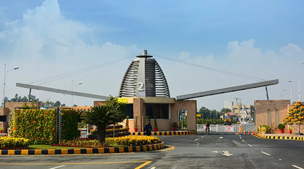 Bahria Orchard Lahore entrance gate with landscaped roundabout on Raiwind Road